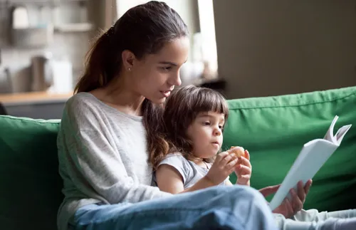 a woman and a child reading together