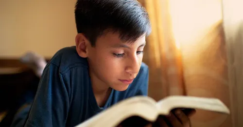 boy reading scriptures