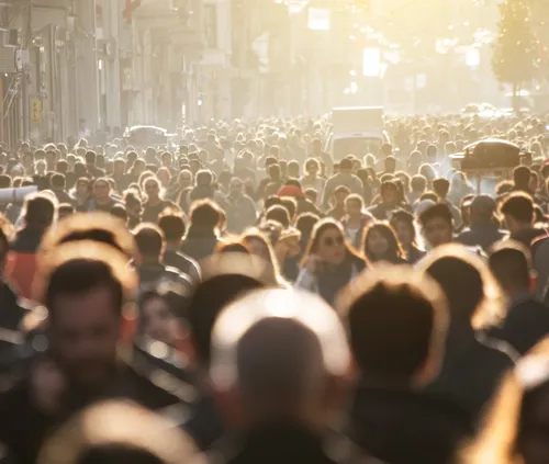 crowd of people walking down the street
