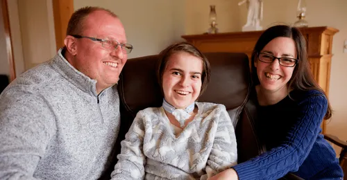 young woman with parents