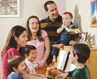 family around a piano