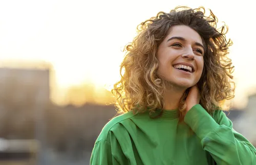 Portrait of young woman with curly hair