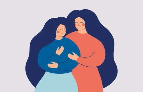 a woman comforting another woman