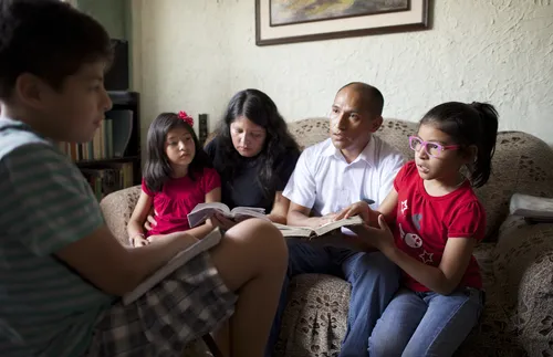 family discussing the scriptures