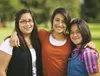 three smiling young women