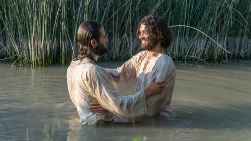 John and Jesus embracing at Jesus’s baptism