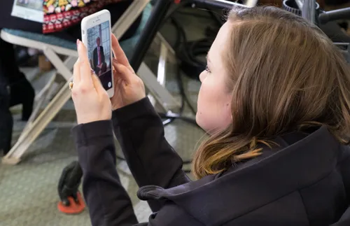 a woman looking at a phone