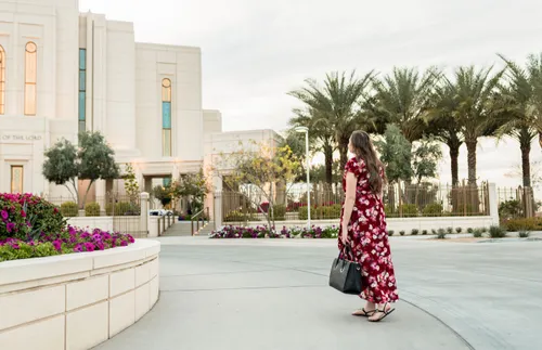 a woman walking toward the temple