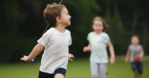 children running in a field