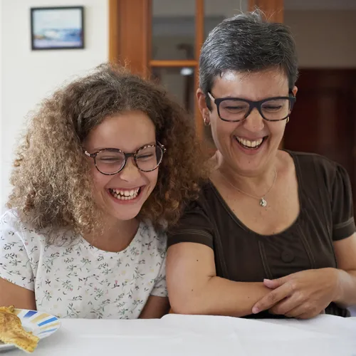 mother and daughter laughing