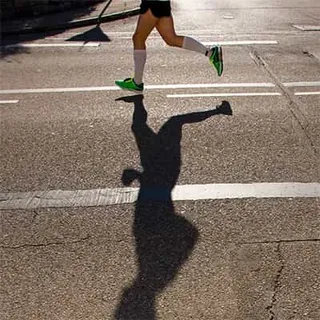 A man jogs down the street one of the do's of the word of wisdom exersise