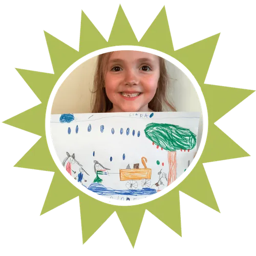 girl holding up drawing