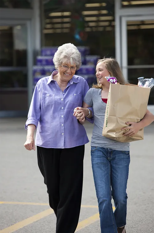 Young woman helping with groceries