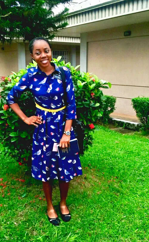 young sister missionary standing outside