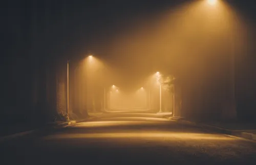 foggy street with lampposts