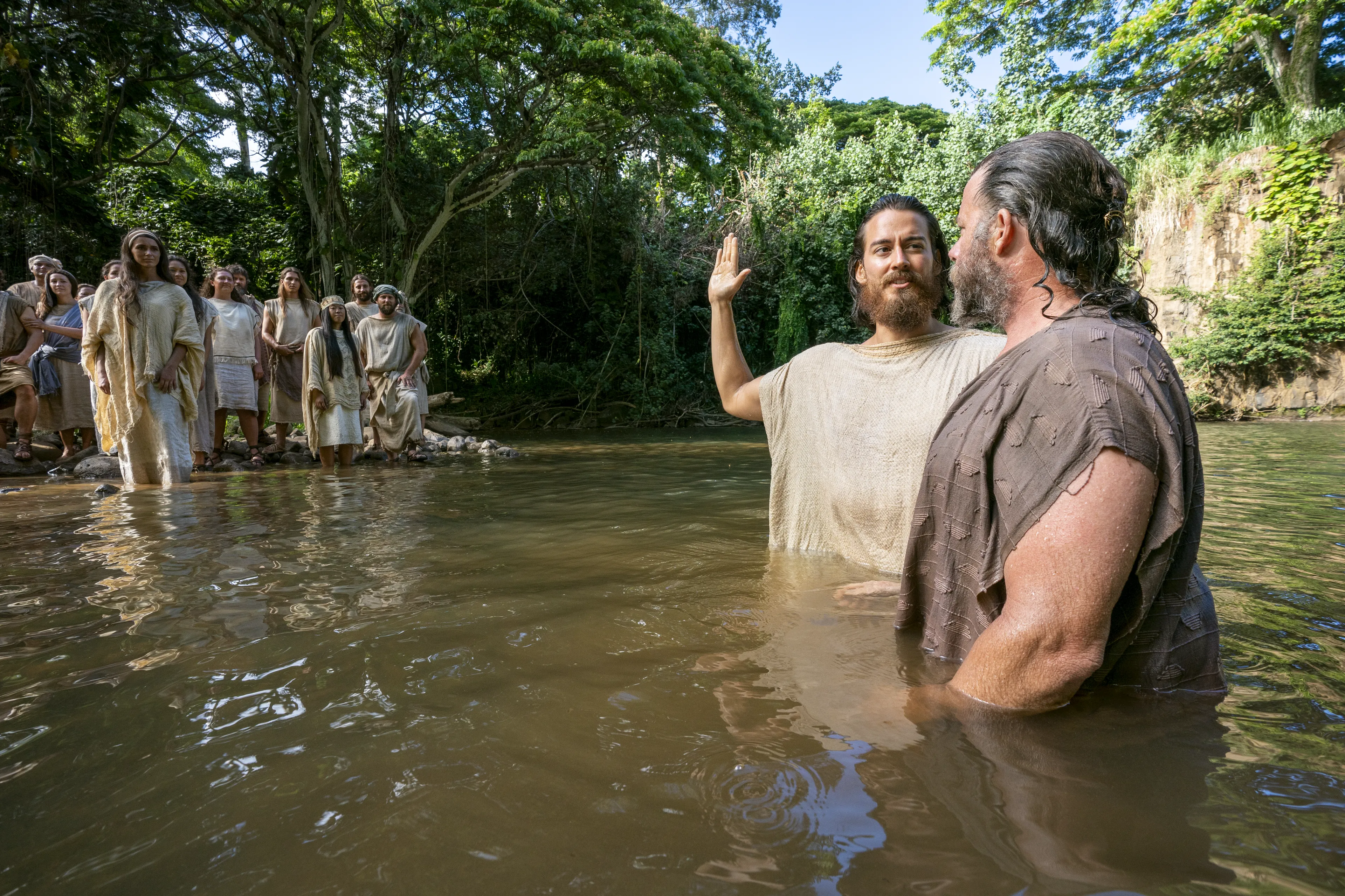 Alma baptizes people at the Waters of Mormon.