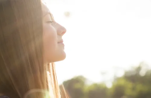 Young woman in sunlight