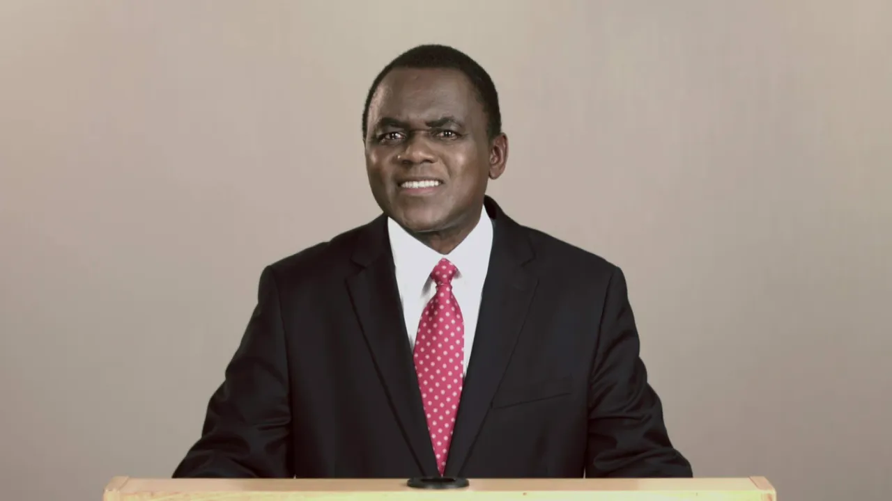 Elder Dube standing to give conference address