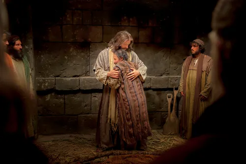 A man standing and embracing Christ after being healed from palsy, while men watch on either side.