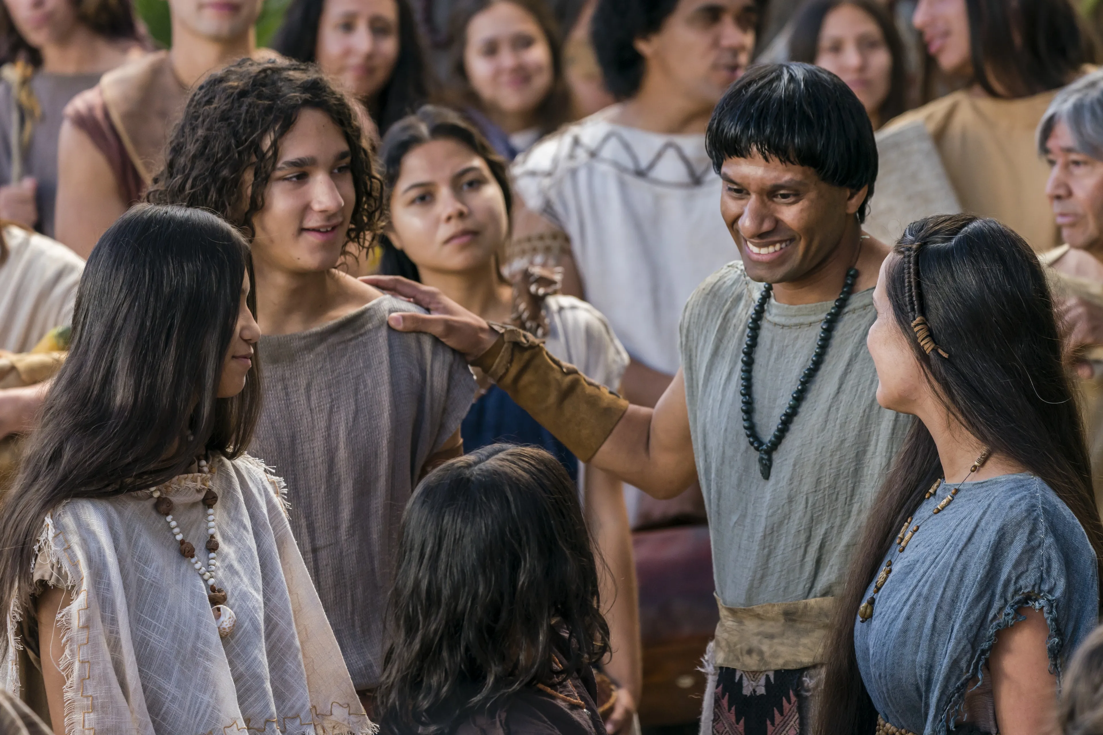 A family smiles together after listening to Alma the Younger preach to the people of Gideon.