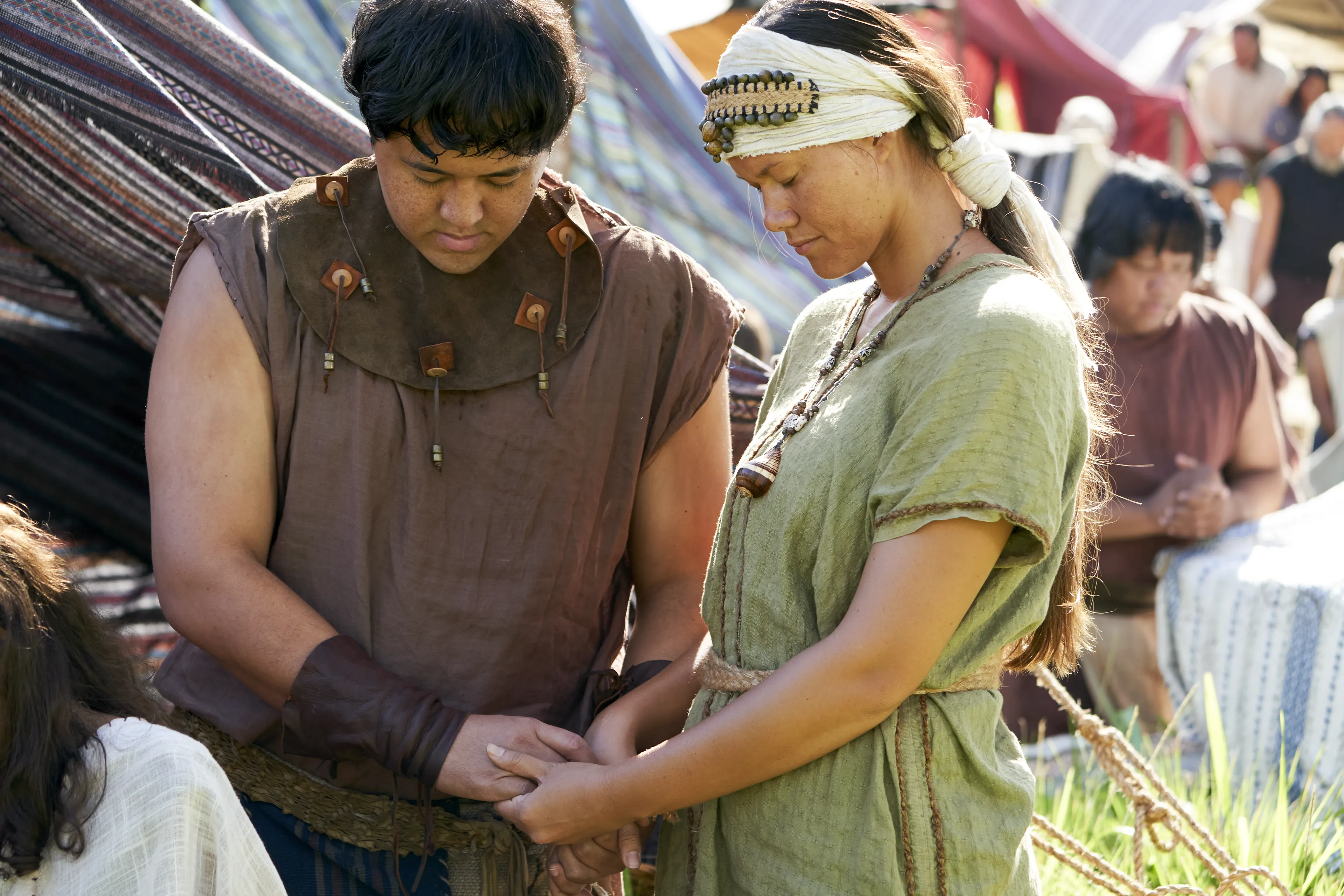 Men and women gather to listen to King Benjamin in the Land of Zarahemla.