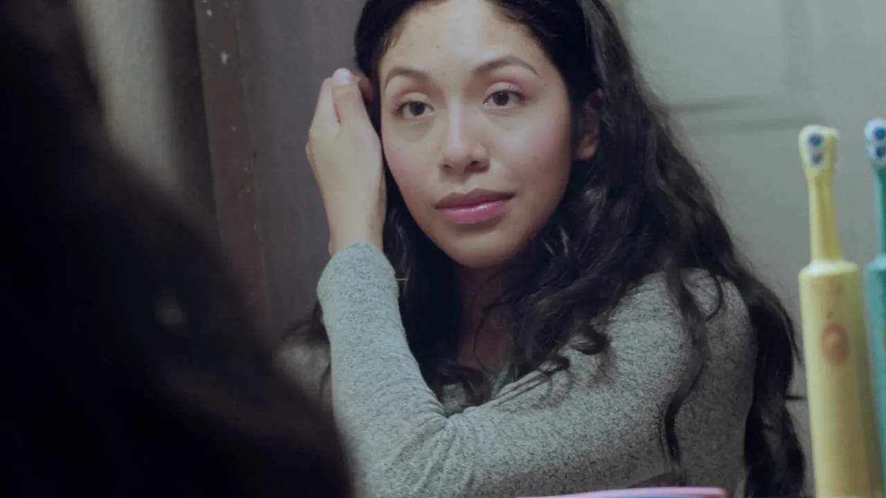 A mother fixes her hair