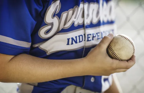 person holding a baseball