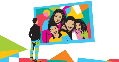 boy looking at family photo