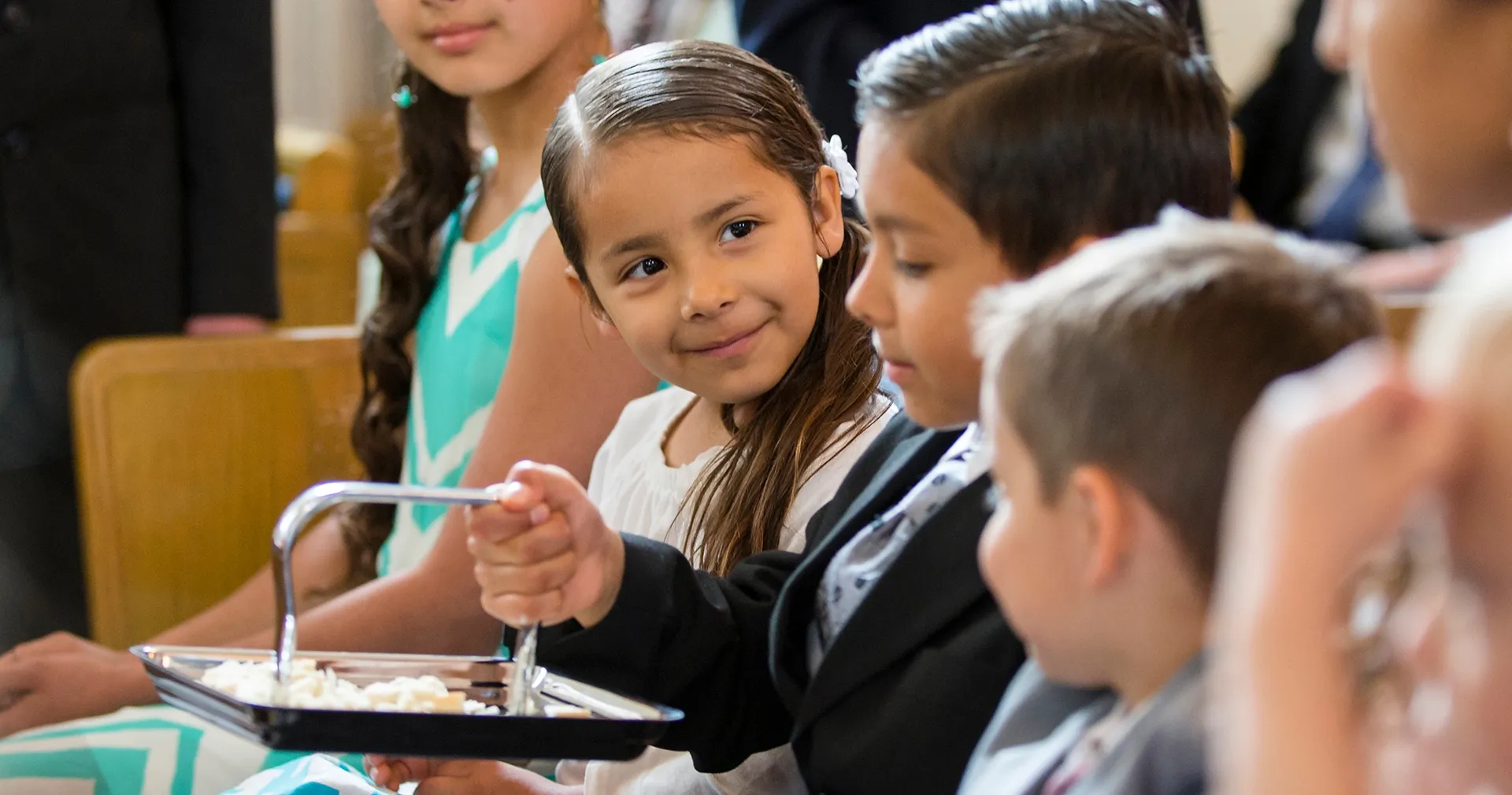 Children partake of the sacrament.