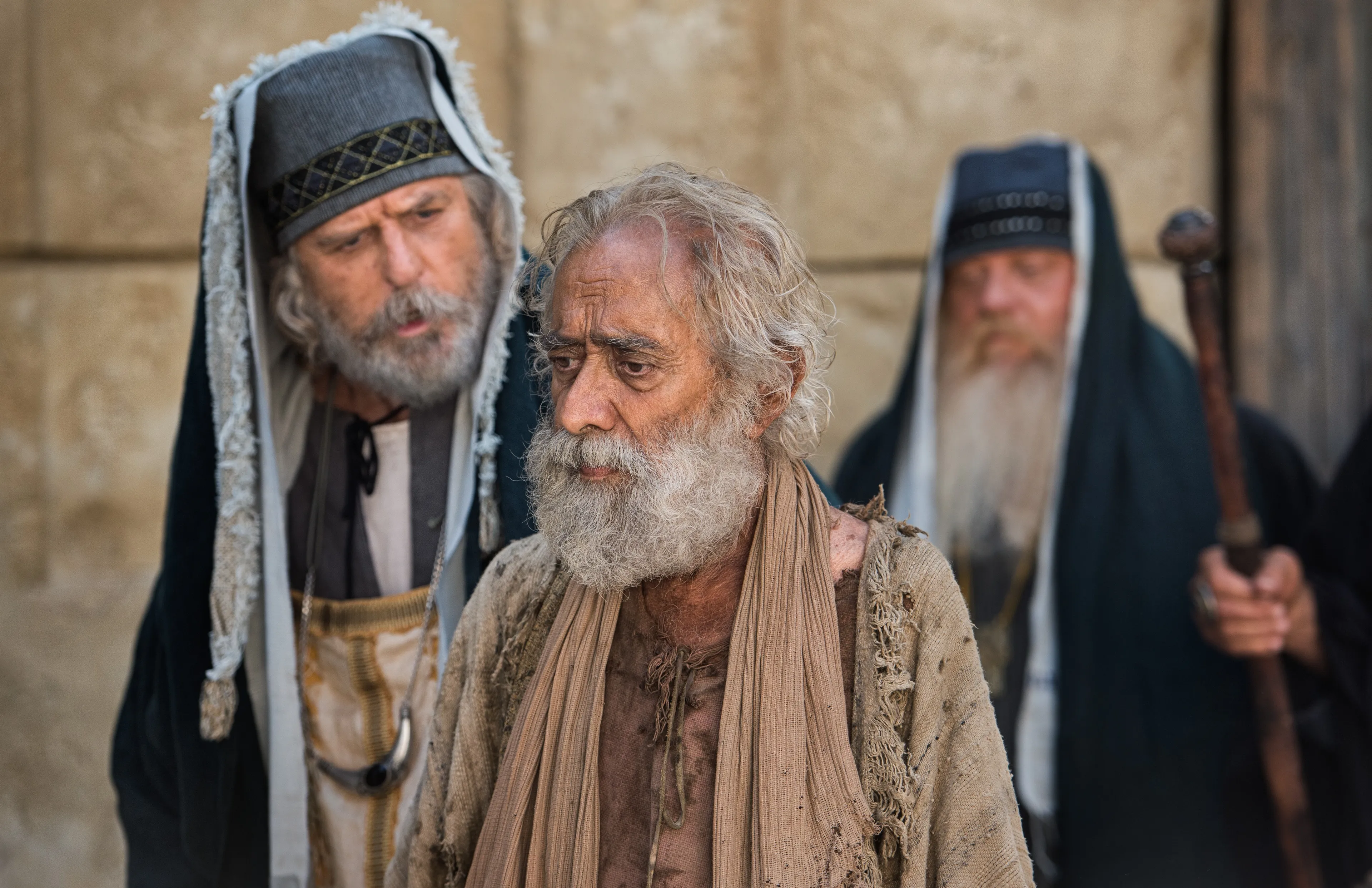 The man from the pool at Bethesda being questioned by the people for carrying his bed on the Sabbath.