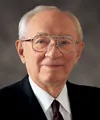 Frontal half-length portrait of President Gordon B. Hinckley. President Hinckley’s hands are resting on the back of a chair. The image is the official Church portrait of President Hinckley as of 1995. This was President Hinckley’s last official portrait. President Hinckley died 27 January 2008.