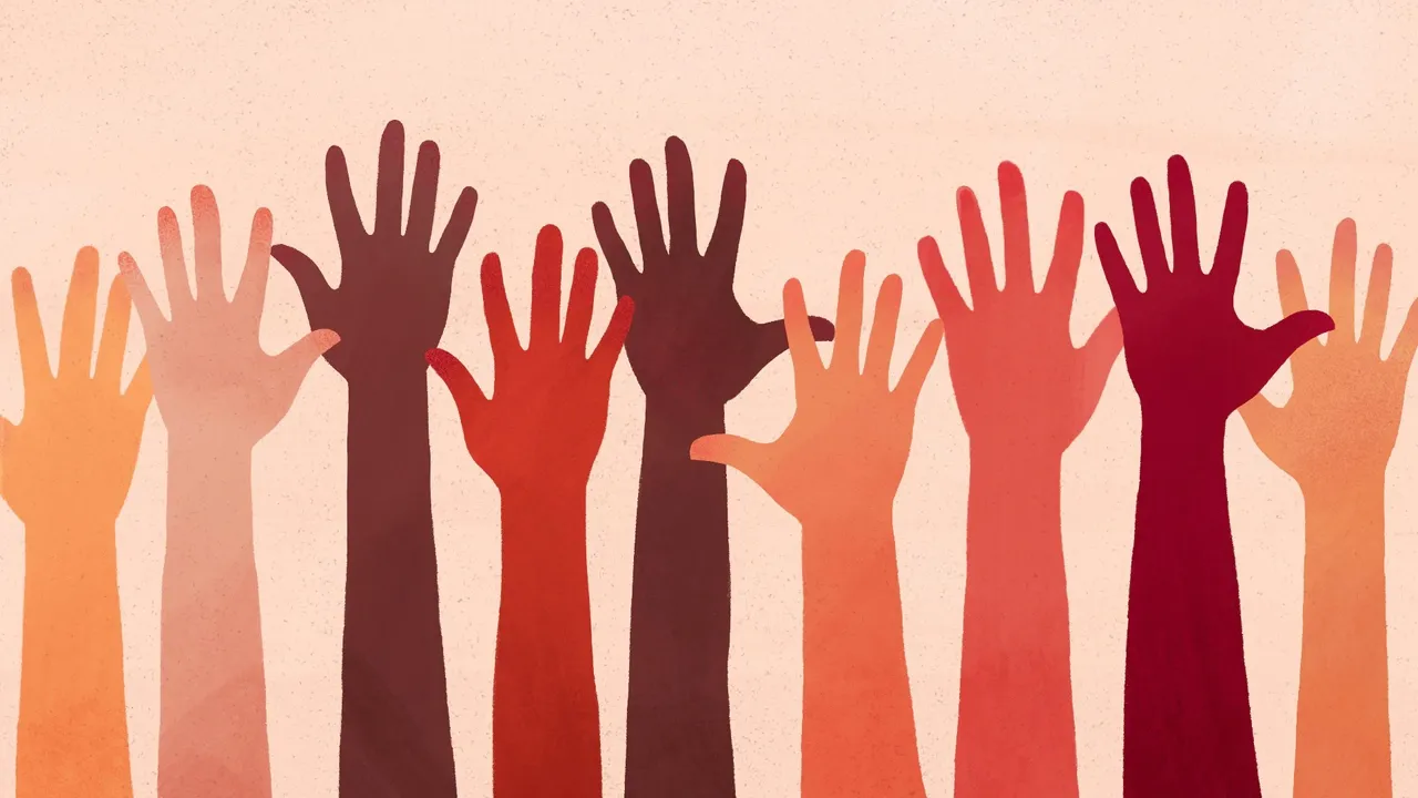 Hands raised in the air participate in a Sunday service church meeting