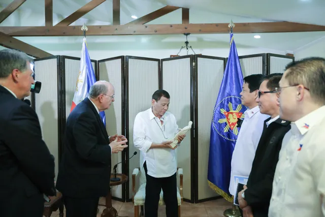 Elder Quentin L. Cook of the Quorum of the Twelve Apostles presents Philippine President Rodrigo Roa Duterte a status of the Christus, Wednesday, January 15, 2020.