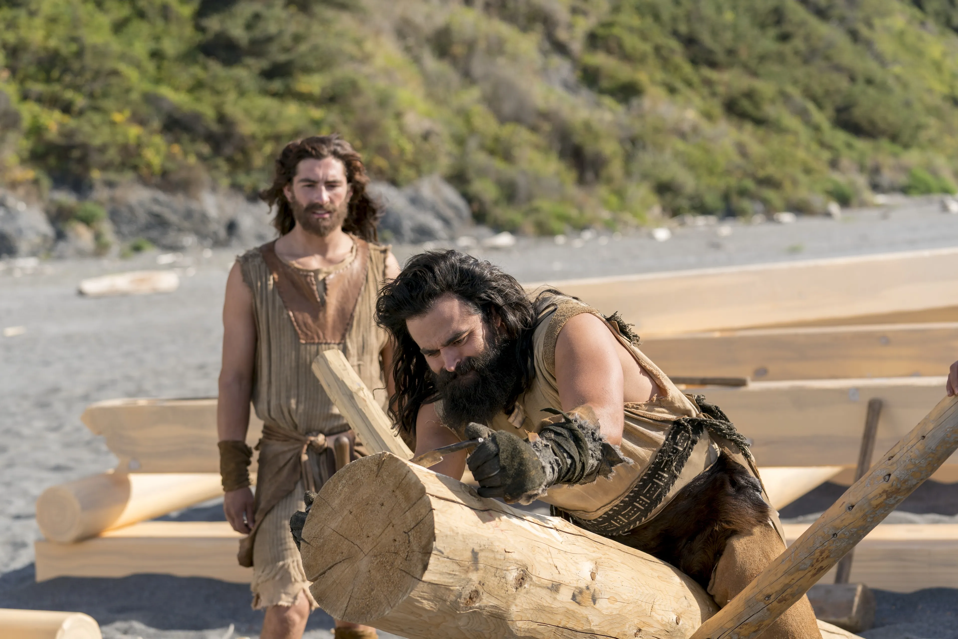 Laman and Nephi build the ship.