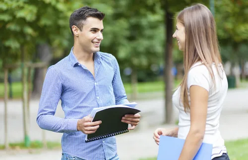 young adult man and woman talking
