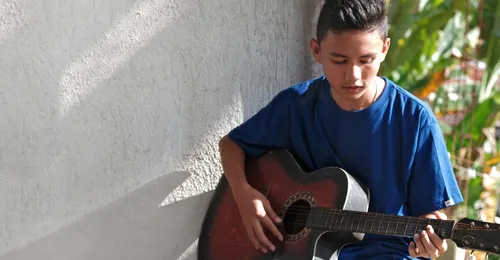 young man playing guitar