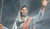 jesus raising hand in the middle of rain