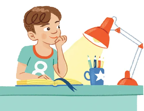 Boy sitting at desk with open book