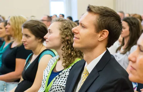 people sitting in Church meeting