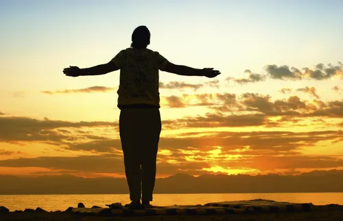 silhouette of woman at sunset