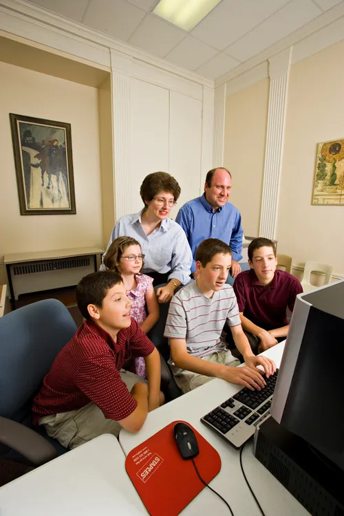 A family at a computer.