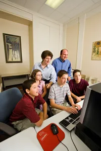 A family at a computer.