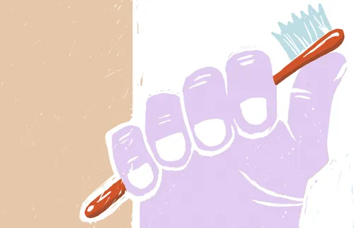 hand holding toothbrush