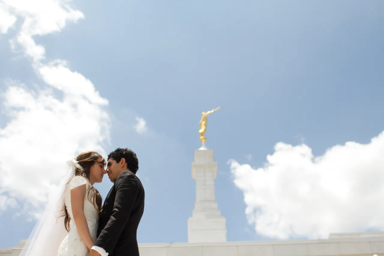 A young couple after they have been married inside the temple