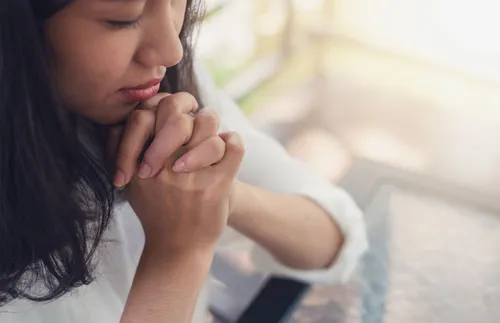 a woman praying
