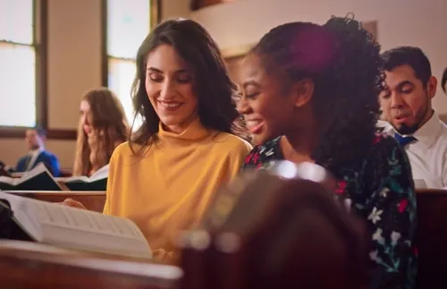 two women sitting in church