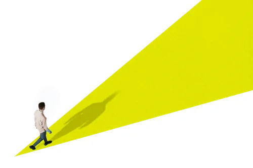 young man walking on yellow ramp