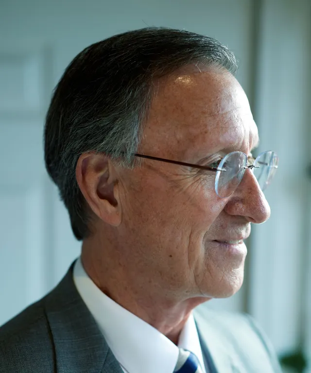 A senior missionary models appropriate dress and grooming. He is wearing an approved suit and tie and has an approved haircut.