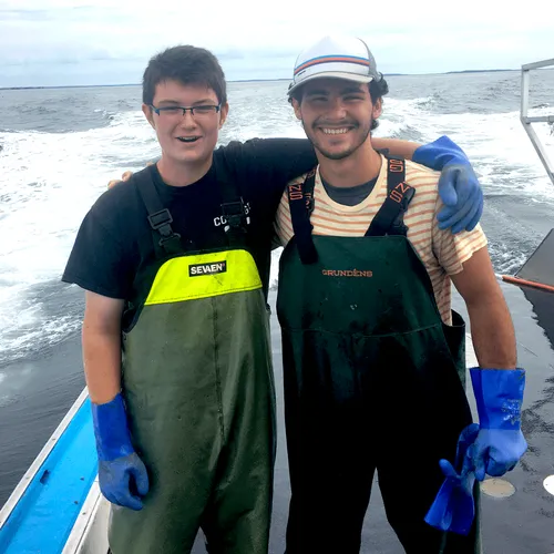 young man and man on boat