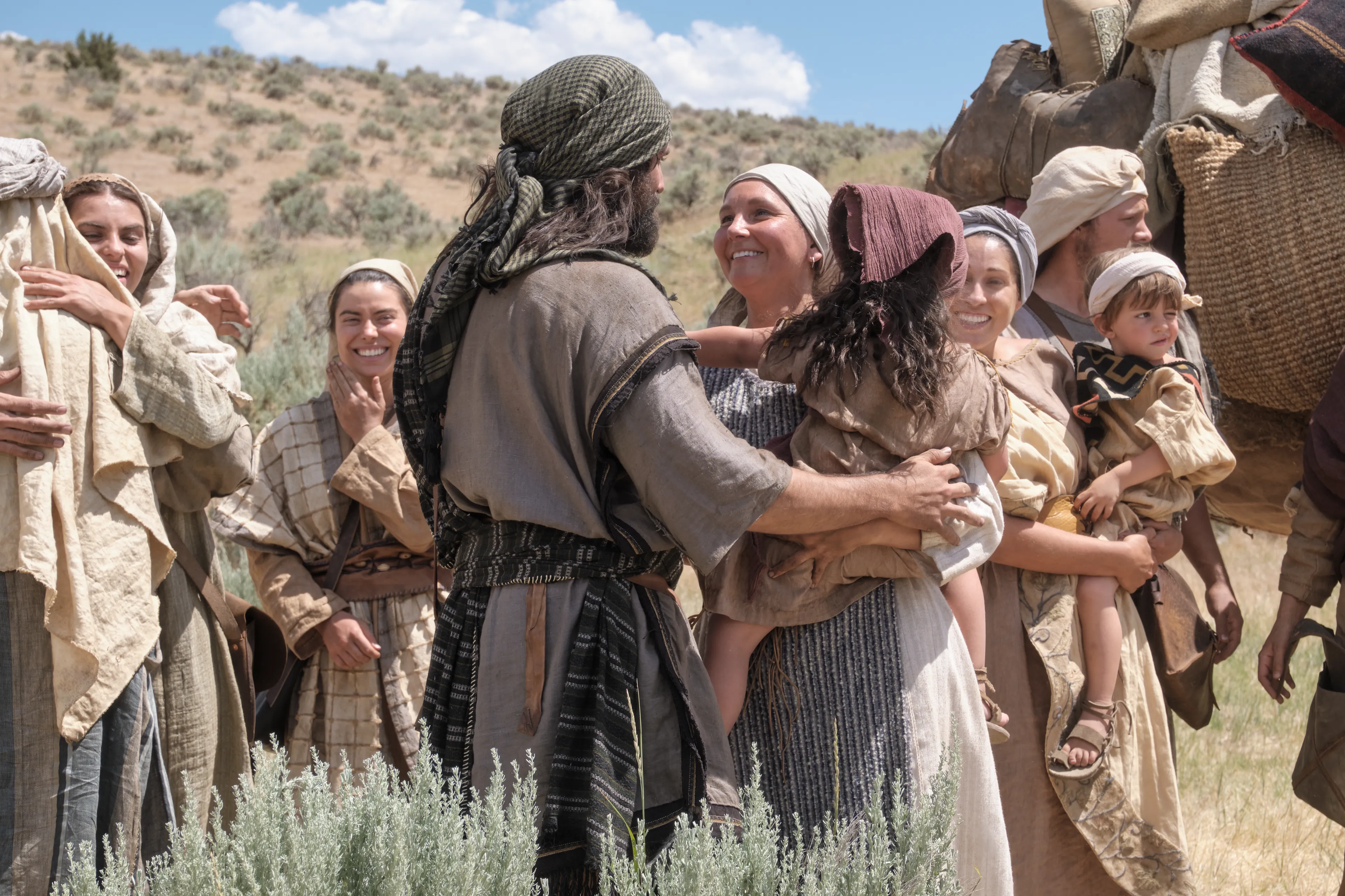 Sariah greets Lemuel as he returns with Ishmael's family to the camp in the wilderness.